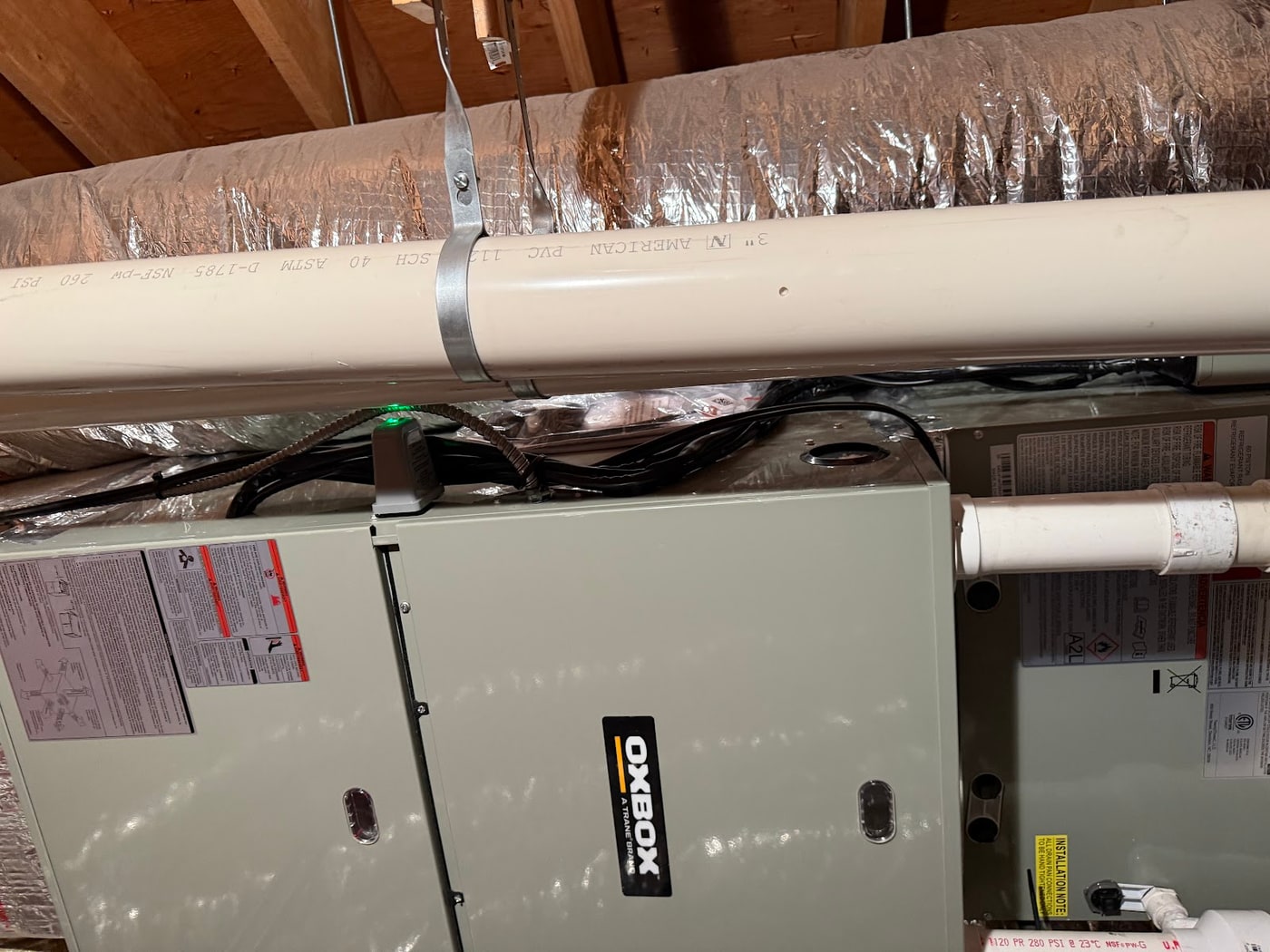 Oxbox air handler and PVC venting installed in an attic by Harbormen Heating and Cooling in East Bridgewater